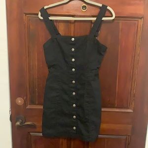Black pinafore dress with silver buttons